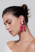 Party earring. Glows in UV lights. Unique Handmade  earring , Pink, rose red, white blended into a beautiful earring.One of a kind. Never to be repeated       A01