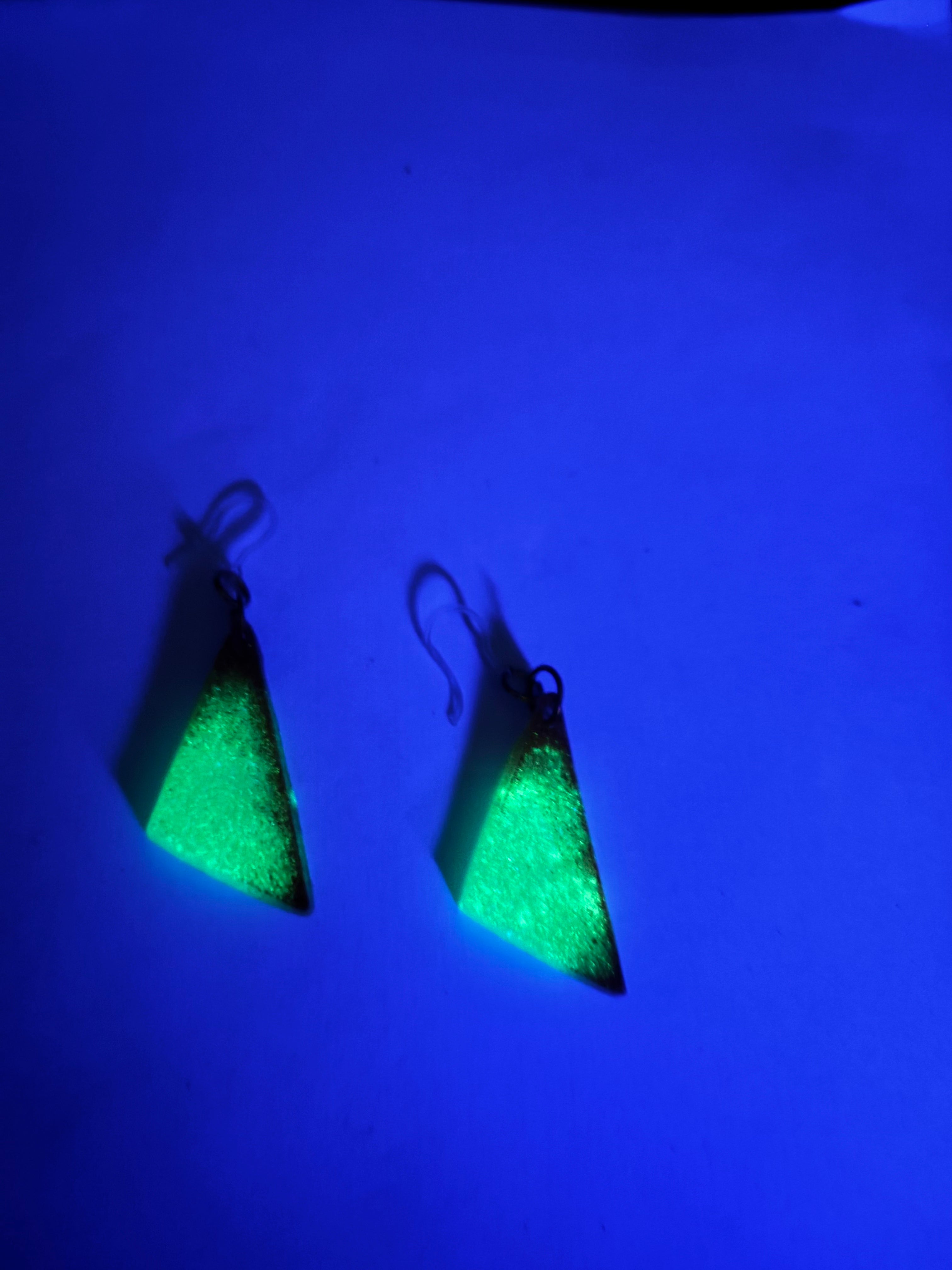 A hypo-allergenic and glow in the dark earring. One of a kind, Unique . Never to be repeated again . Let it shine on you !    K01