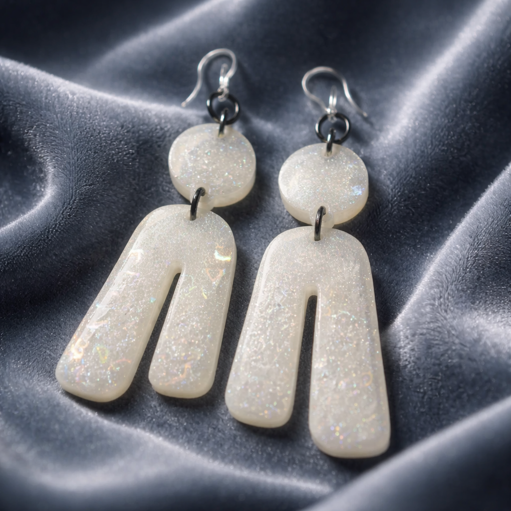 An elegant hypo-allergenic earring that will turn heads. Only one of a kind and not to be repeated, exquisite pearly white.  L03