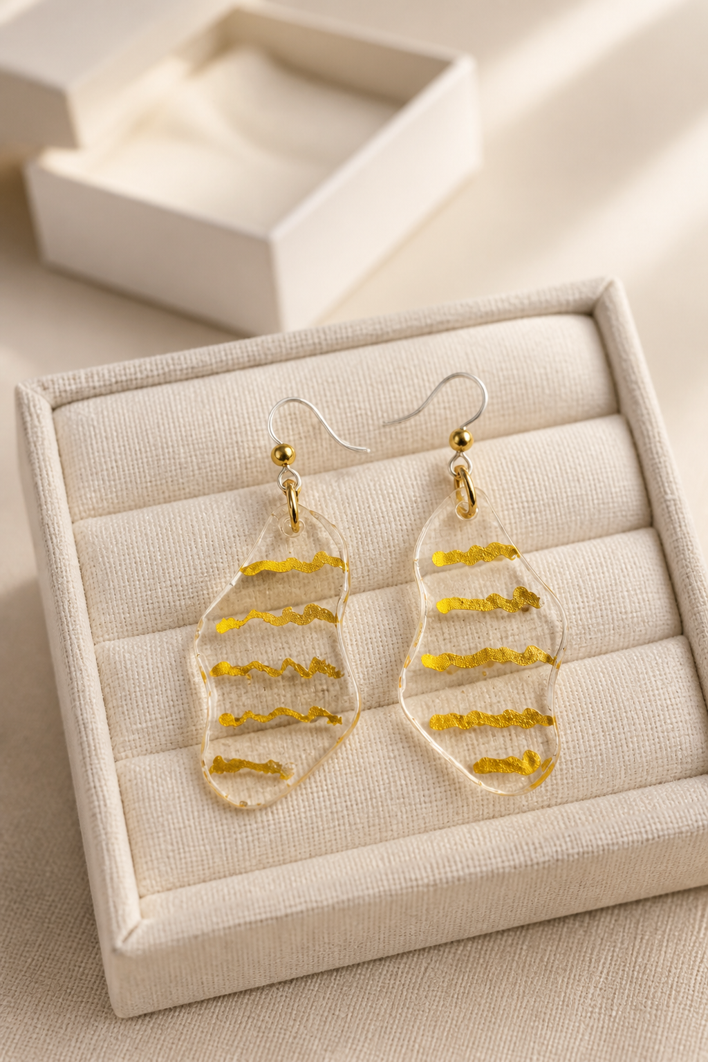 An elegant handmade resin earring designed to add a bold and stylish touch to your look.  L06