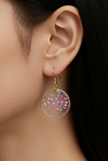 A bold day and night earring. Glow in the dark with gold plated hypo-allergenic hooks for a long and comfortable wear.   M06