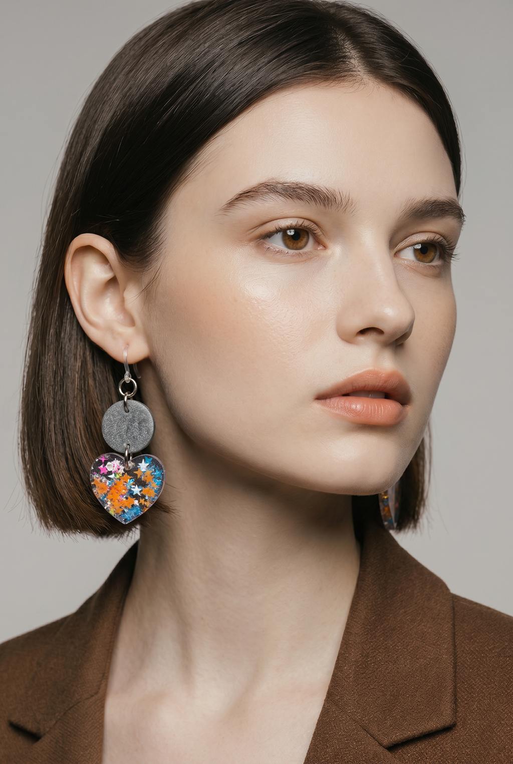A glam funky party earring with comfy hooks and uv glow. Elegance to take home .    R012