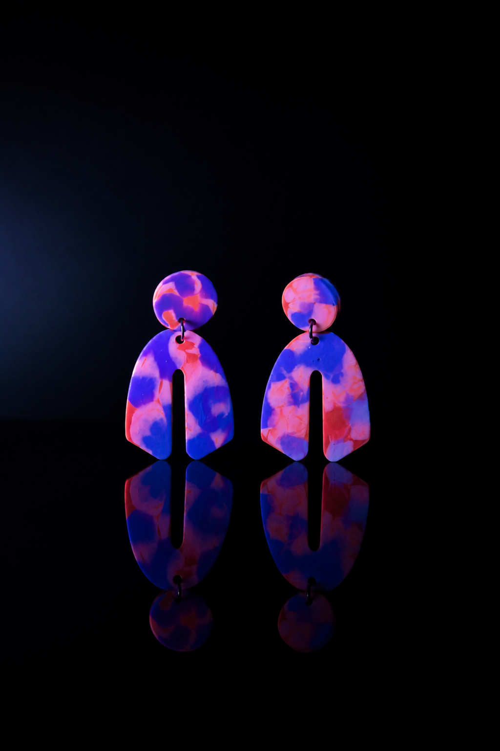 Beautiful cool party handmade earrings. UV glow to add sparkle to your party . Be the center of attraction .       C01
