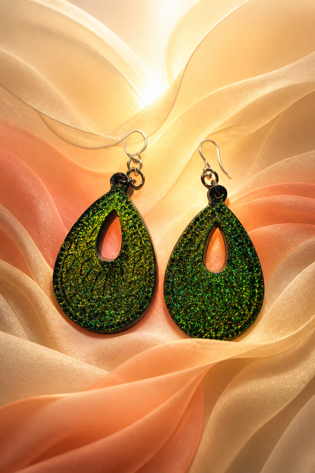 Elevate your look with these striking green texture earrings. Design X04 www.chakor.co.za