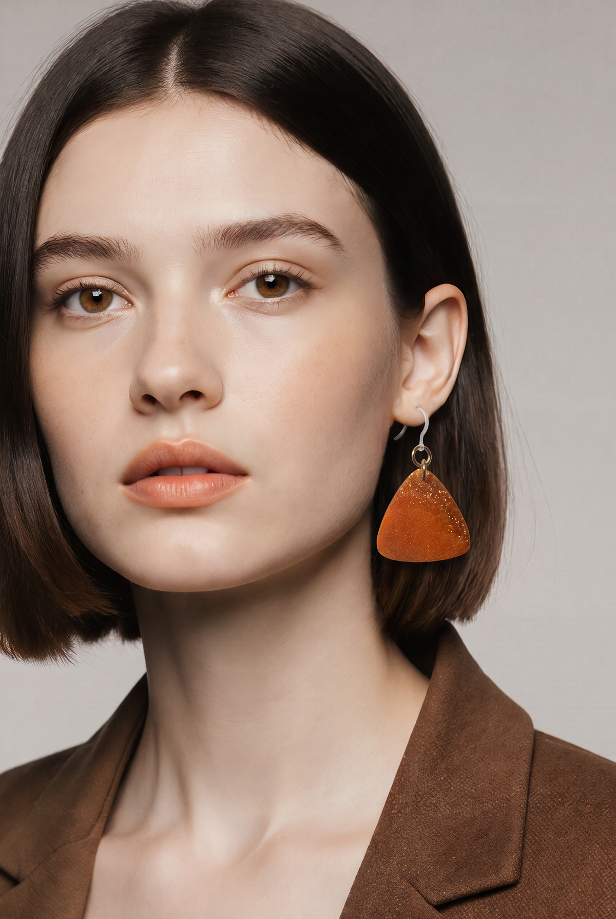 A beautiful beauty . Elevate your look with these radiant, glitter-infused earrings. Design H08 www.chakor.co.za